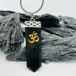 Black Tourmaline gold etched  “OM” Pendant encased in white metal